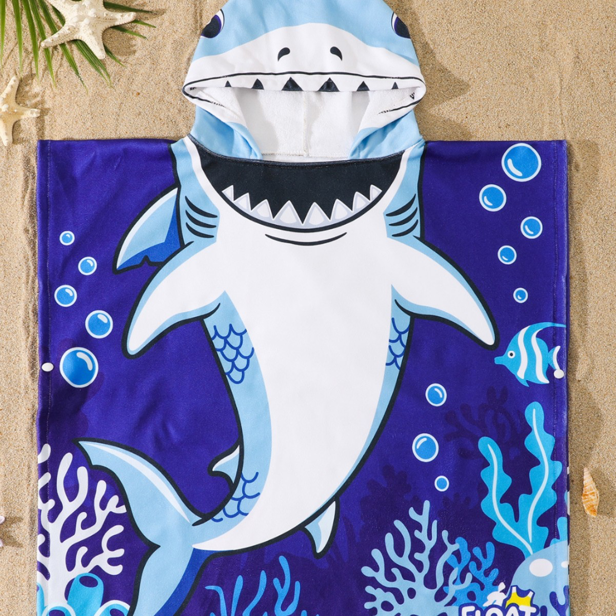 Children's hooded beach towels in shark, mermaid, dinosaur, and princess designs with hooded poncho style and snap closures.