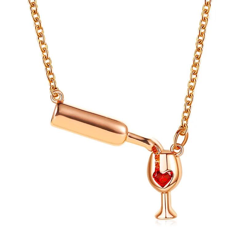 Close-up of a polished copper wine bottle necklace with a red zircon crystal pendant on an adjustable chain