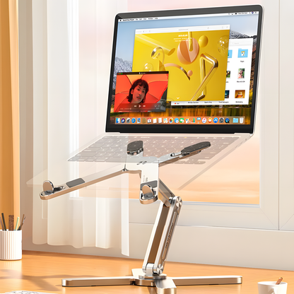 Rotating adjustable laptop stand in silver with folding frame and silicone grips for flexible desk setups