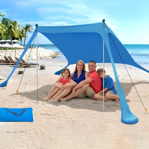 Blue beach shade canopy set up on sand with carry bag nearby