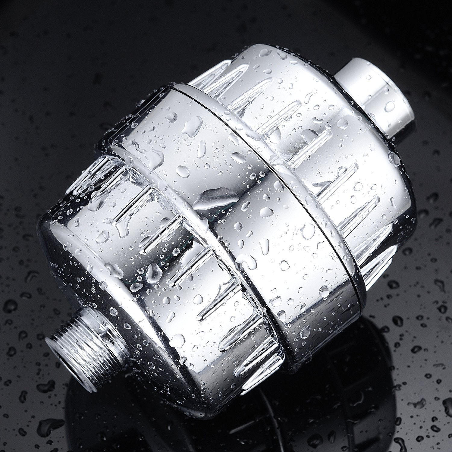 Compact 20-layer shower filter with replaceable cartridge and chrome ABS housing installed between shower connection and hose