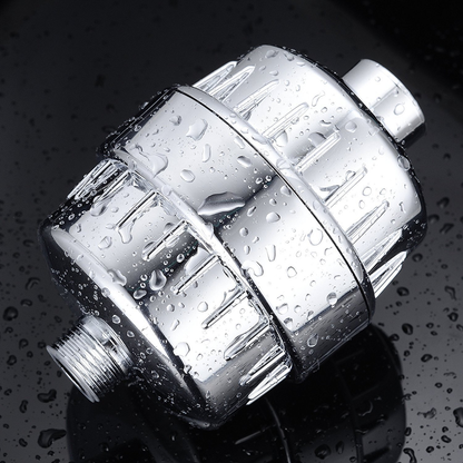 Compact 20-layer shower filter with replaceable cartridge and chrome ABS housing installed between shower connection and hose